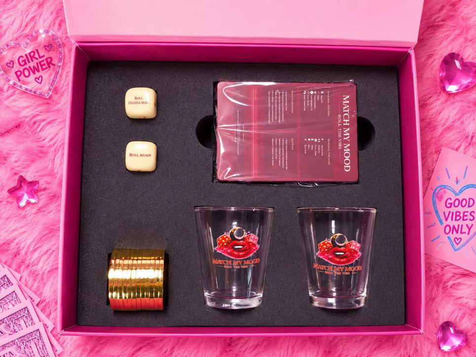 Match My Mood game box interior with shot glasses and dice on a pink fur background