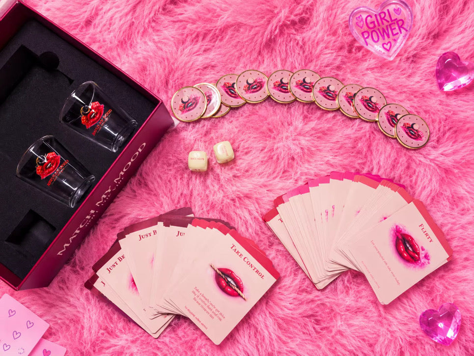 Match My Mood pink cards fanned out beside the game box, dice and Safe Mode tokens